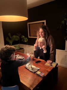 Nancy helping my son, Cosmo, light the Hannukah candle the year before last (December 2024). sonia aggarwal